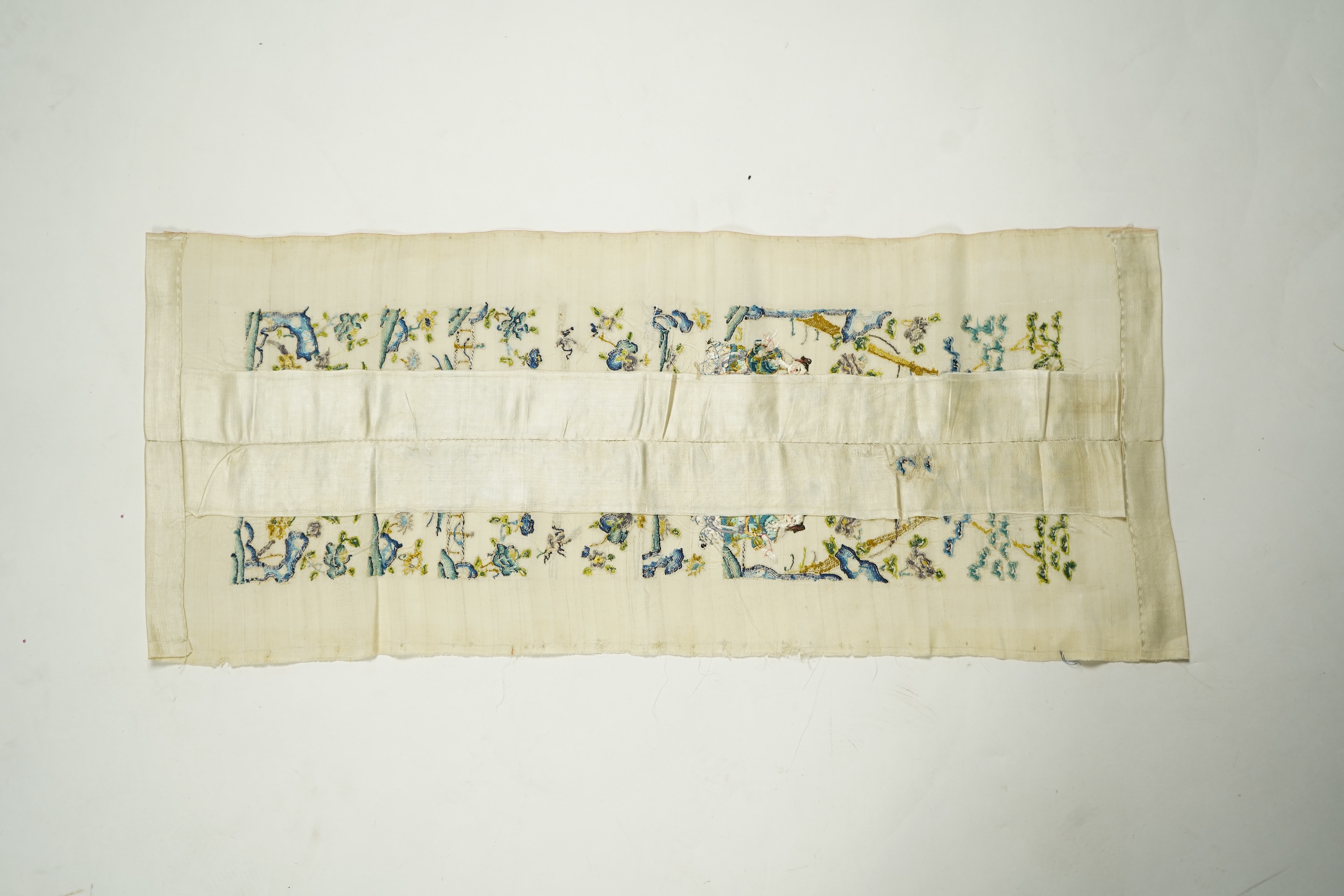 A pair of late 19th century Chinese figurative silk embroidered sleeve bands. Embroidered on cream silk using mostly Chinese knot, couched with gold thread. 53cm x 9cm each wide. Condition - cream silk, embroidery are bo